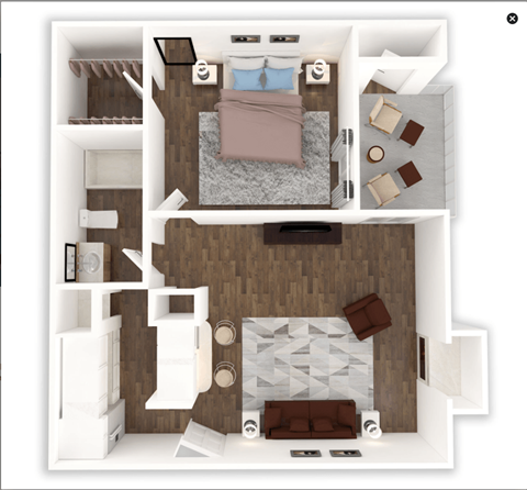 A top-down view of a small apartment with a bed, couch, and kitchen area.